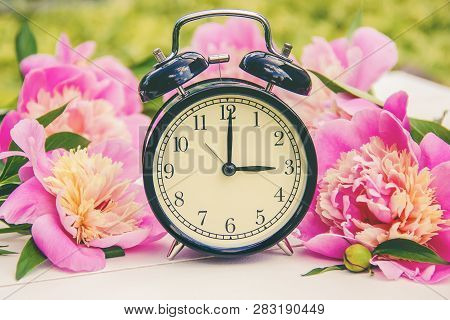 Spring Flowers And Alarm Clock. Change The Time.