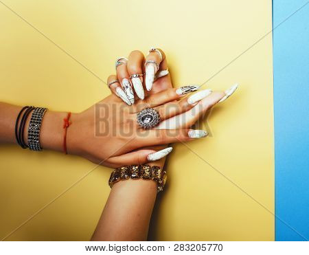 Woman Hands Holding Colorful Paper Copyspace Wearing A Lot Of Jewelry And Long Nails