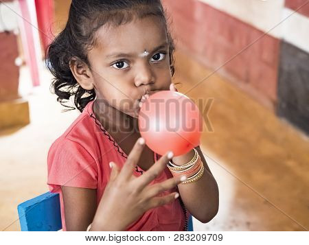 Puduchery, India - December Circa, 2018. Unidentified Cute Beautiful Poor Smiling Kidindlatting Ball