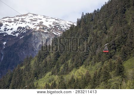 The View Of Mount Juneau And A Cable Car Going Down To Juneau Downtown (alaska).