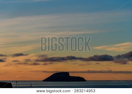 View Of A Small Isalnd In Front Of Angra Do Heroismo During Sunrise. Azores, Portugal