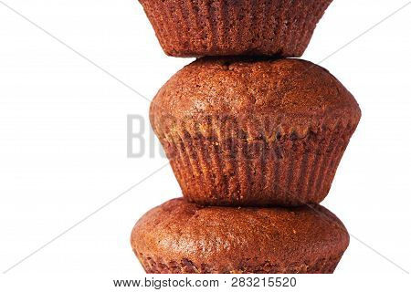 A Chocolate Muffin With Dark Test Isolated On A White Background.