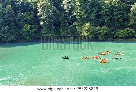 Kayaks On The River Aare. Rafting On The River Aare. Swimmers In Bern
