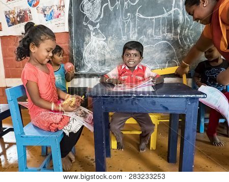 Puduchery, India - December Circa, 2018. Poor Preschool Teacher And Her Group Of Kids Boys Girls Hav