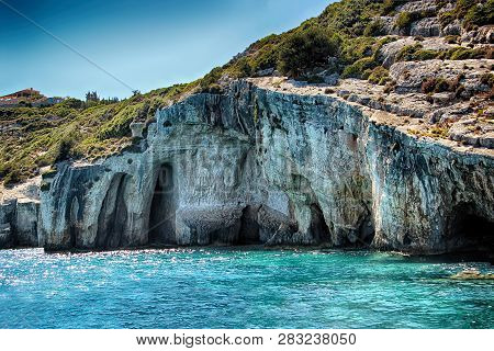 Blue Caves On The Sea In Zakynthos In Greece. Clear Water Of Medditerian Sea In Sunny Day At Summer.