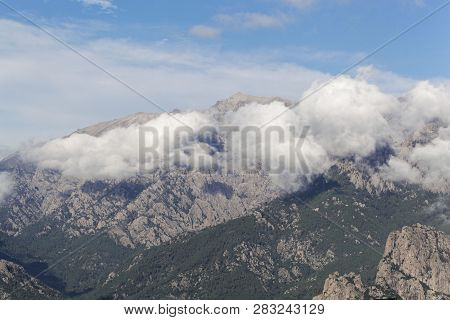 Mountains With Clouds In Central Corsica, France.