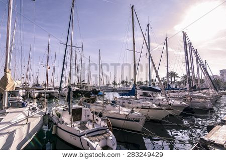 Moored Boats Along The Paseo Maritimo On A Sunny Winter Day