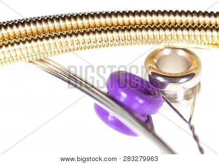 Strings For Guitar Isolated On A White Background. Macro