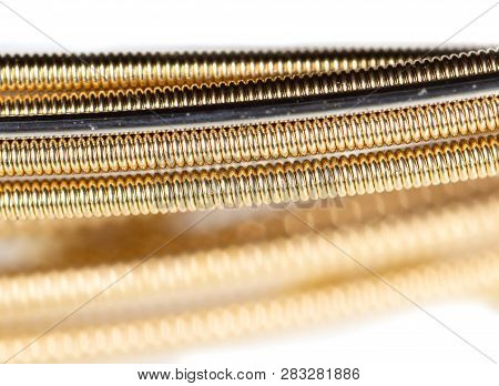 Strings For Guitar Isolated On A White Background. Macro