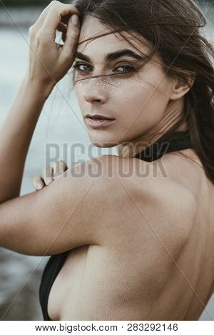 Beautiful Sexy Woman With Golden Frackles On The Beach