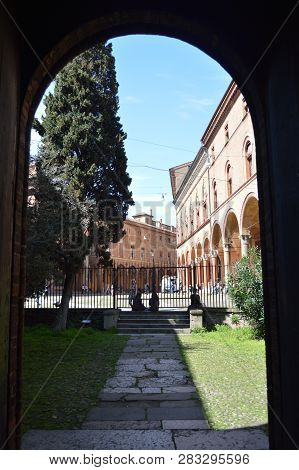 Interior Courtyard Of The Basilica Of Santo Stefano Is Observed The Via Di Stefano In Bologna. Trave
