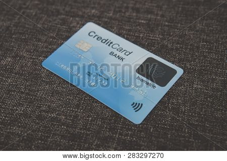 Close Up Of Credit Biometric Card Belonging To Abstract Cardholder Lying On Coarse Fabric. E-shoppin
