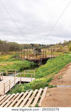 Working Watermill Wheel With Falling Water In The Village