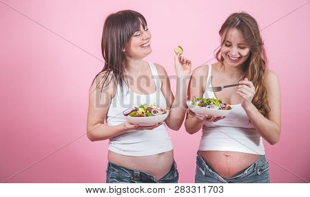 Maternity Concept, Two Pregnant Woman Eating Fresh Salad