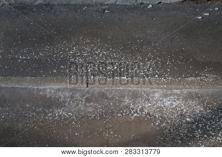 Deicing Chemicals On Asphalt Road In Moscow