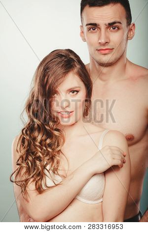 Sexy Passionate Couple In Studio. Handsome Half Naked Semi Nude Man And Pretty Woman In Lingerie. Lo