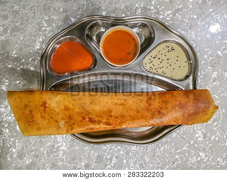 Masala Dosa And Idli Dosa Food Closeup With Selective Focus And Crop Fragment. It Is A Popular South