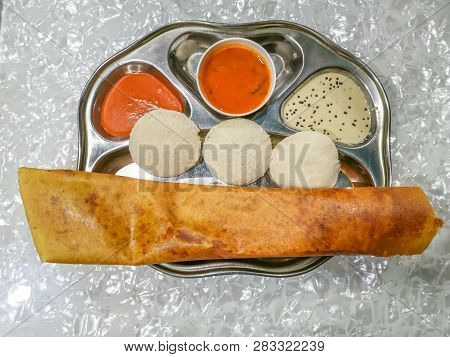 Masala Dosa And Idli Dosa Food Closeup With Selective Focus And Crop Fragment. It Is A Popular South