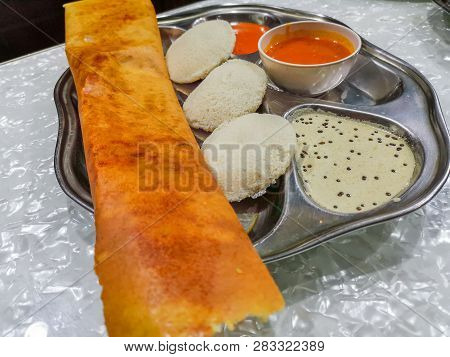 Masala Dosa And Idli Dosa Food Closeup With Selective Focus And Crop Fragment. It Is A Popular South