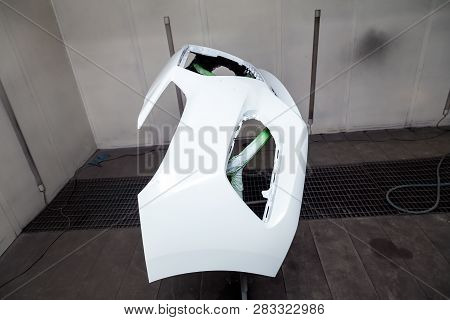 Repair Of The Rear Bumper Of A White Car After An Accident With The Help Of Multi-colored Putty In A