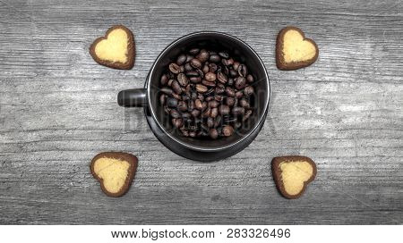 Coffee With Cookies. Ripe Coffee Beans In A Coffee Mug With Cookies In The Form Of Hearts