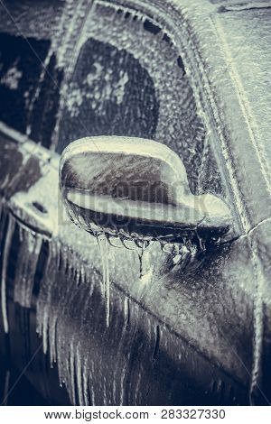 Close Up Shot Of A Frozen Car Mirror After Freezing Rain.
