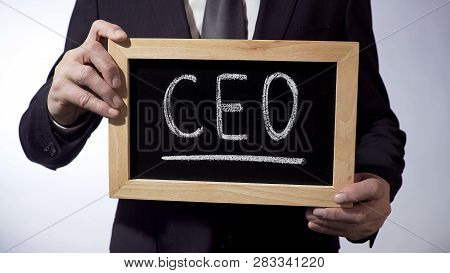 Ceo Written On Blackboard, Man In Classic Suit Holding Sign, Business Strategy