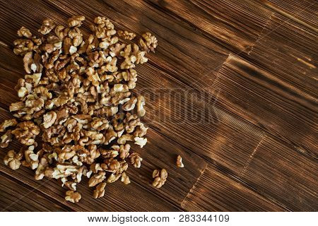 Peeled Walnuts On A Natural Wooden Surface From Pine Boards. Rustic Still Life.