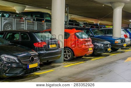 Cars Parked In A Indoor Parking Garage, Long Row Of Cars, Commercial Parking Lot