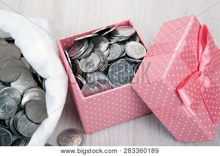 Open Pink Gift Box With Russian Ruble Coins And A Bag With Coins Close Up