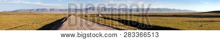 Unpaved Road And Yurts Near Son-kul Lake And Tien Shan Mountains In Kyrgyzstan