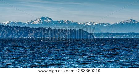 A View Of The Olympic Mounain Range Aross The Puget Sound.