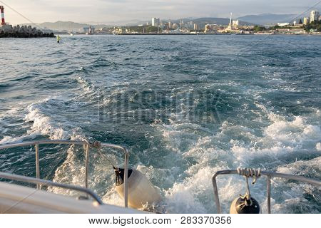 Waves And Foam Astern Of The Yacht When Leaving The Port.