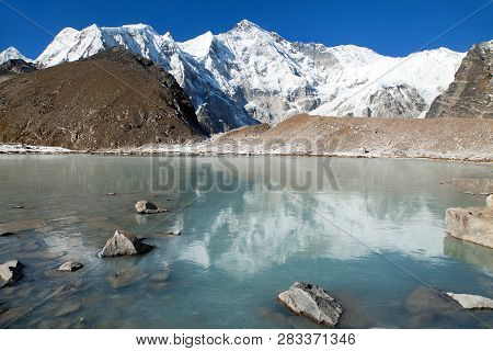 View Of Mount Cho Oyu Mirroring In Lake - Cho Oyu Base Camp - Everest Trek - Nepal Himalayas Mountai