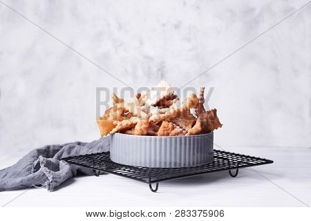 Brushwood - Russian Traditional Cookies With Powdered Sugar. Food Consept. Plate With Hvorost On Whi