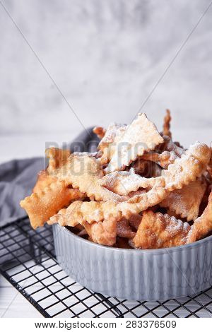 Brushwood - Russian Traditional Cookies With Powdered Sugar. Food Consept. Plate With Hvorost On Whi