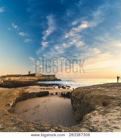 Carcavelos, Portugal - 12/31/18: Saint Julian Fortress With Lighthouse Tower, Beach (praia) Of Carca