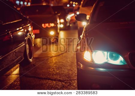 Night View Of The Cars. Road In The City At The Night With Yellow And Red Electrical Light For Cars 