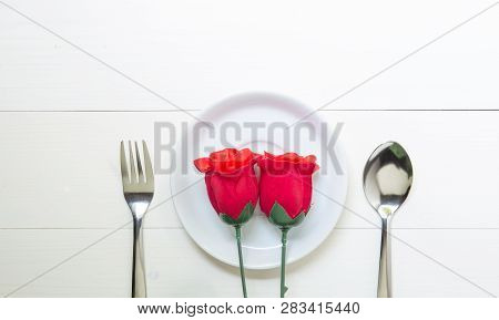 Present Gift With Red Rose Flower And Dish And Spoon And Fork On Wooden Table, 14 February Of Love D