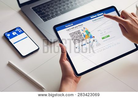 Bangkok, Thailand - March 11, 2019 : Hand Is Pressing The Facebook Screen On Apple Iphone X ,social 