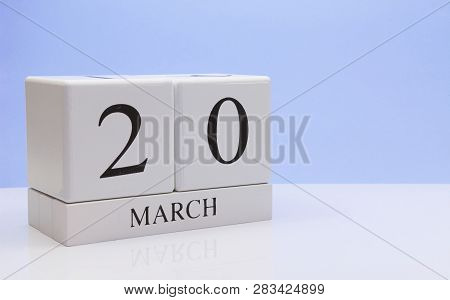 March 20st. Day 20 Of Month, Daily Calendar On White Table With Reflection, With Light Blue Backgrou