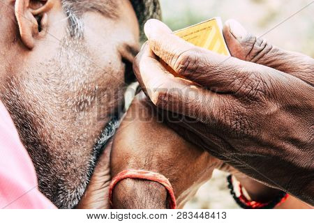 Varanasi India November 19, 2018 View Of A Unknown Sadhu Smoking A Chillum In The Streets Of Varanas