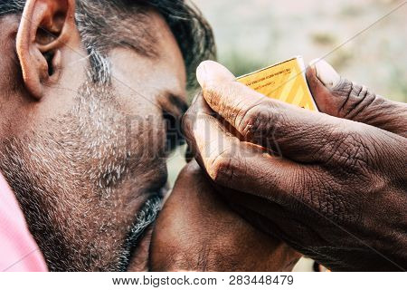 Varanasi India November 19, 2018 View Of A Unknown Sadhu Smoking A Chillum In The Streets Of Varanas