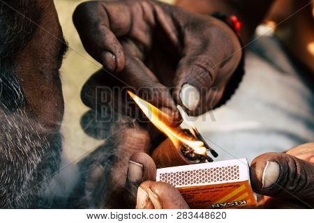 Varanasi India November 19, 2018 View Of A Unknown Sadhu Smoking A Chillum In The Streets Of Varanas