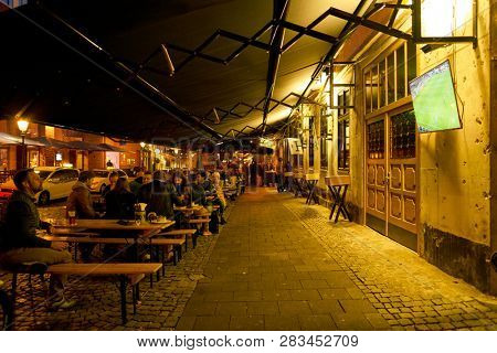 DUSSELDORF, GERMANY - CIRCA SEPTEMBER, 2018: people drink beer at a bar in Dusseldorf.