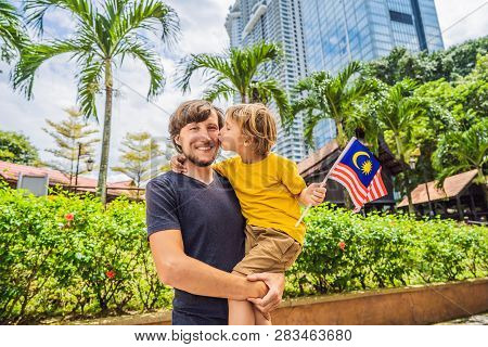 Father And Son Travelers In Malaysia With Malaysia Flag Celebrating The Malaysia Independence Day An