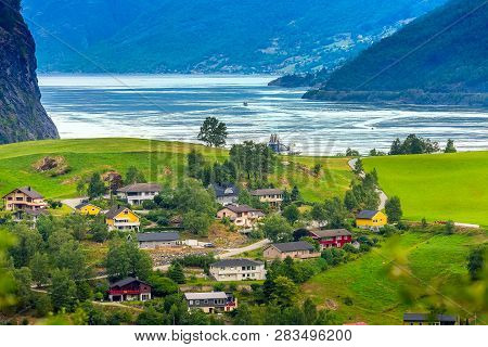 Flam, Norway, Norwegian Fjord Village With Sognefjord Landscape And Cruise Ship