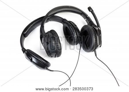Black Wired High-fidelity Headset And Ear Speakers With Full Size Headphones Lose-up On A White Back