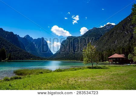 Lake Dobbiaco in the Dolomites, Beautiful Nature Italy natural landscape Alps.