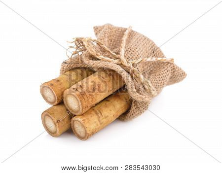 Fresh Burdock Root Or Gobo In Sack On White Background
